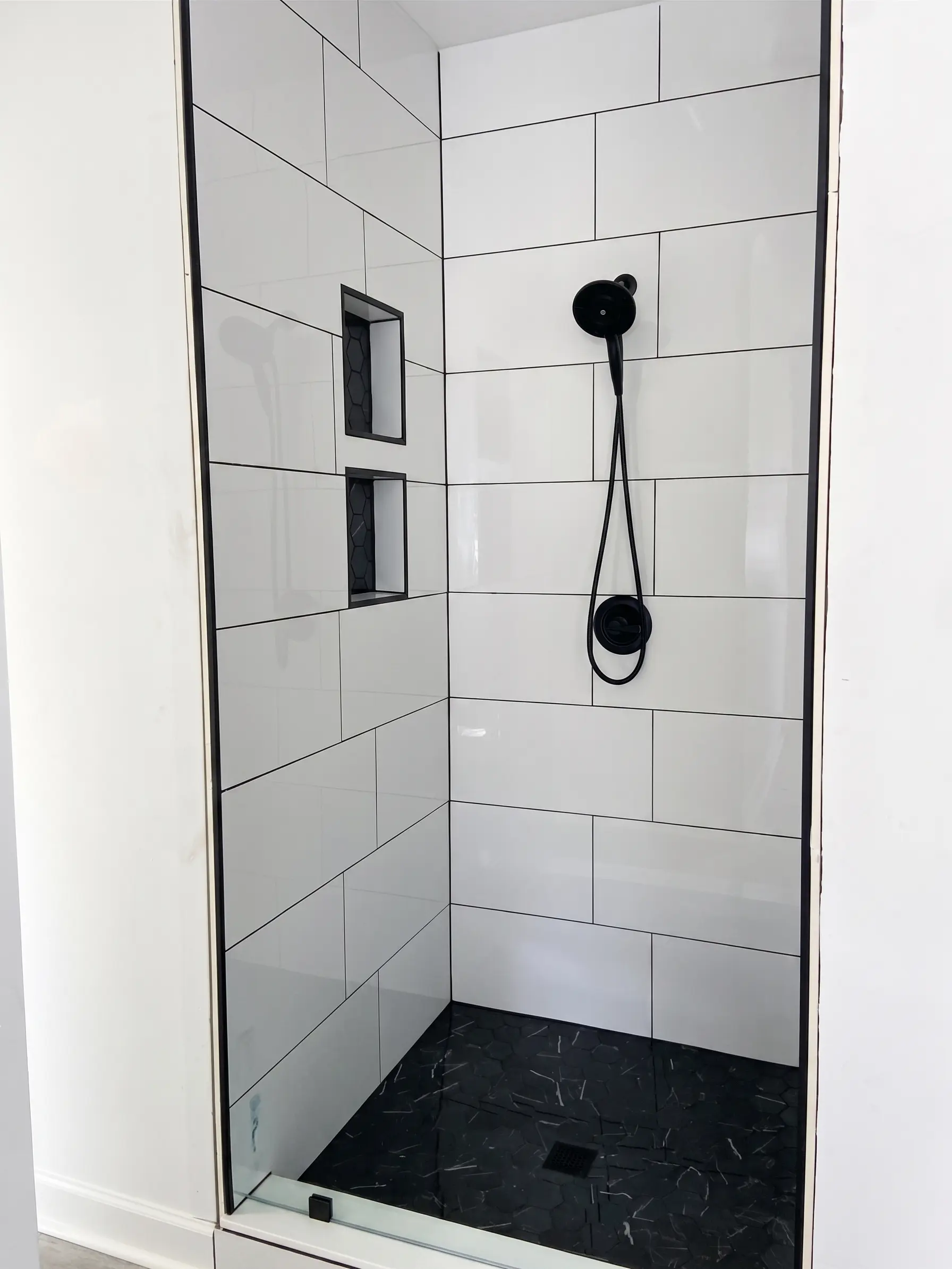 Shower tile installation by Complete Handy Solutions