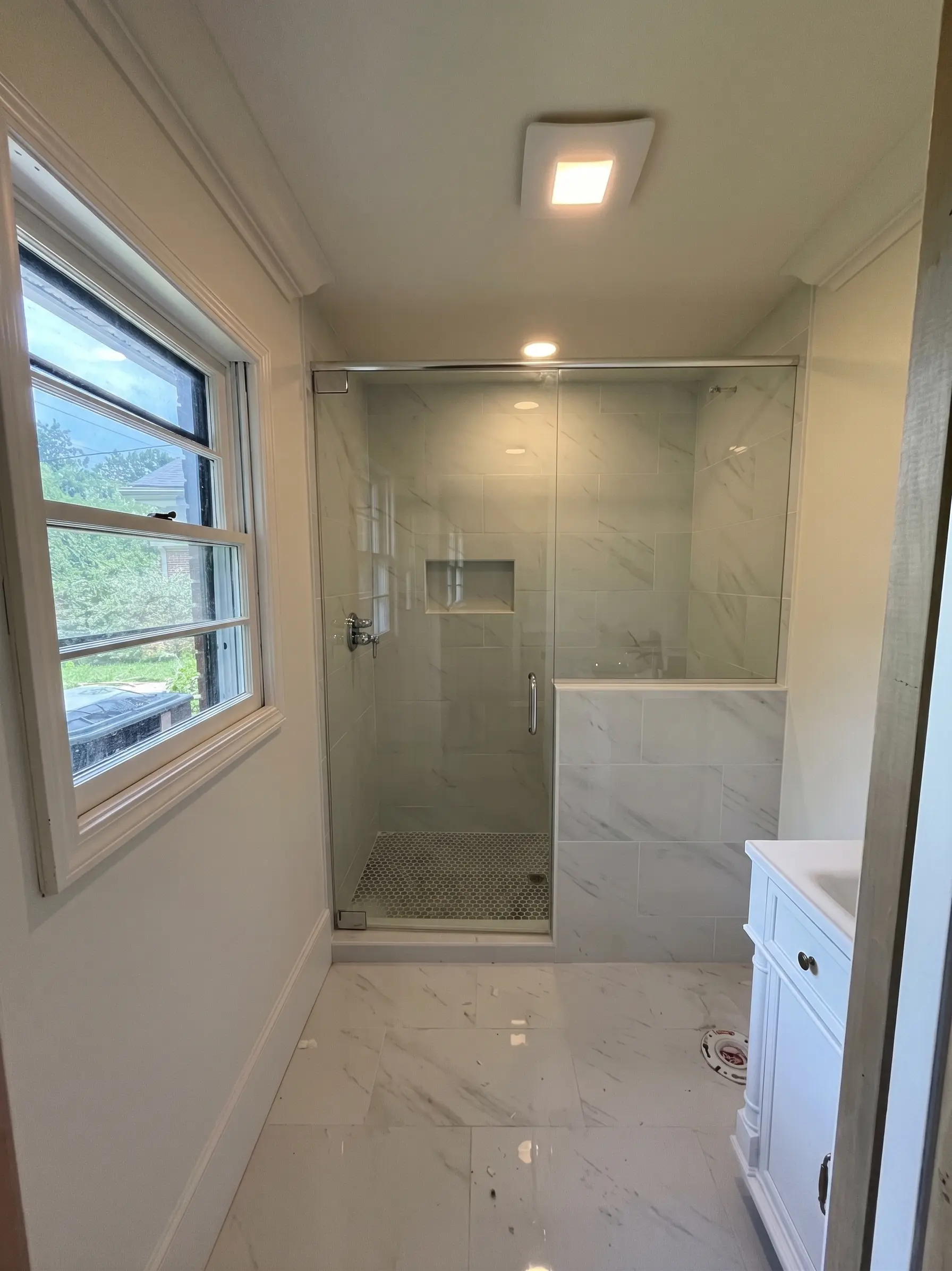 Modern bathroom shower installation by Complete Handy Solutions