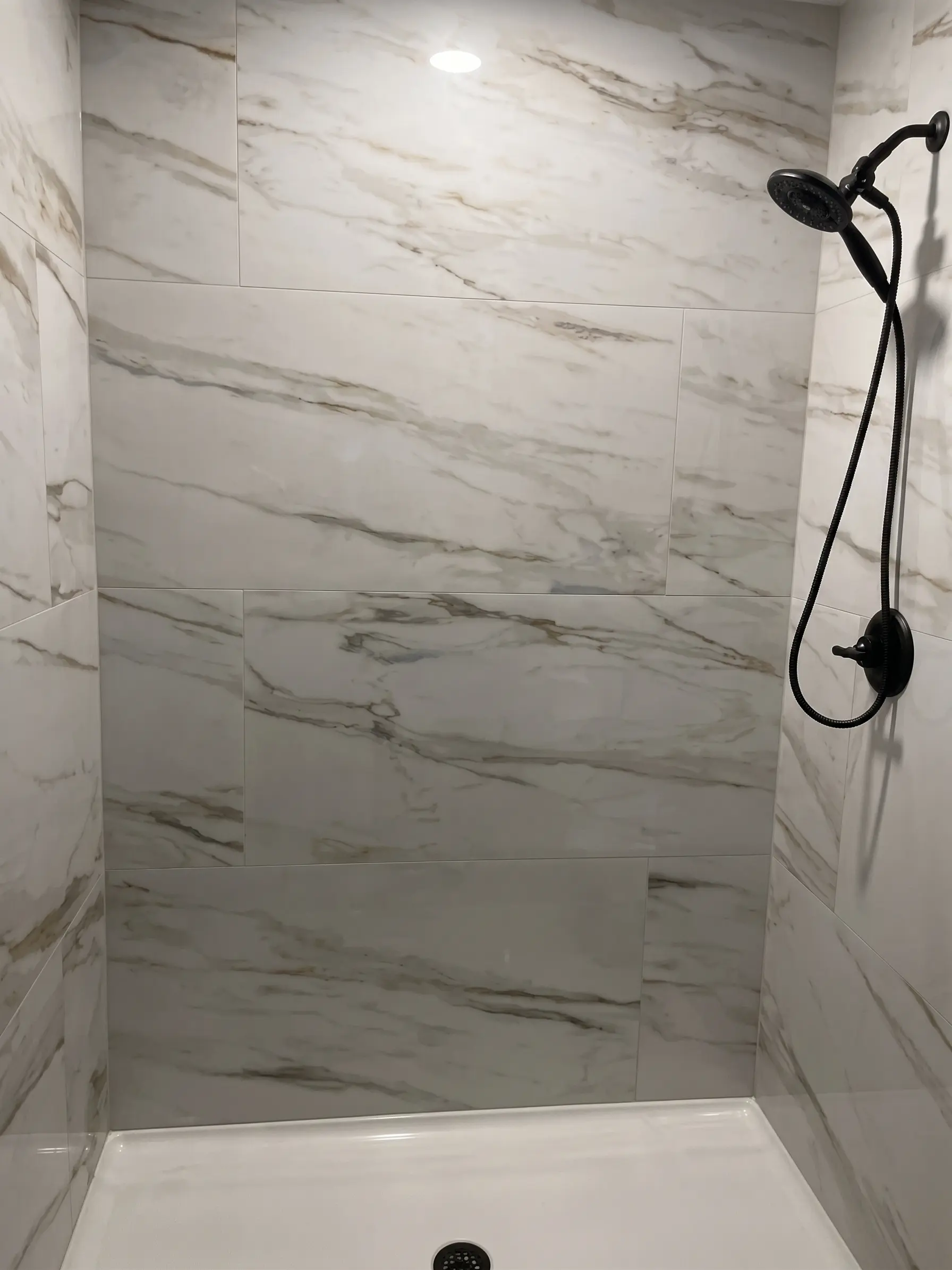 Walk-in shower stall installation by Complete Handy Solutions